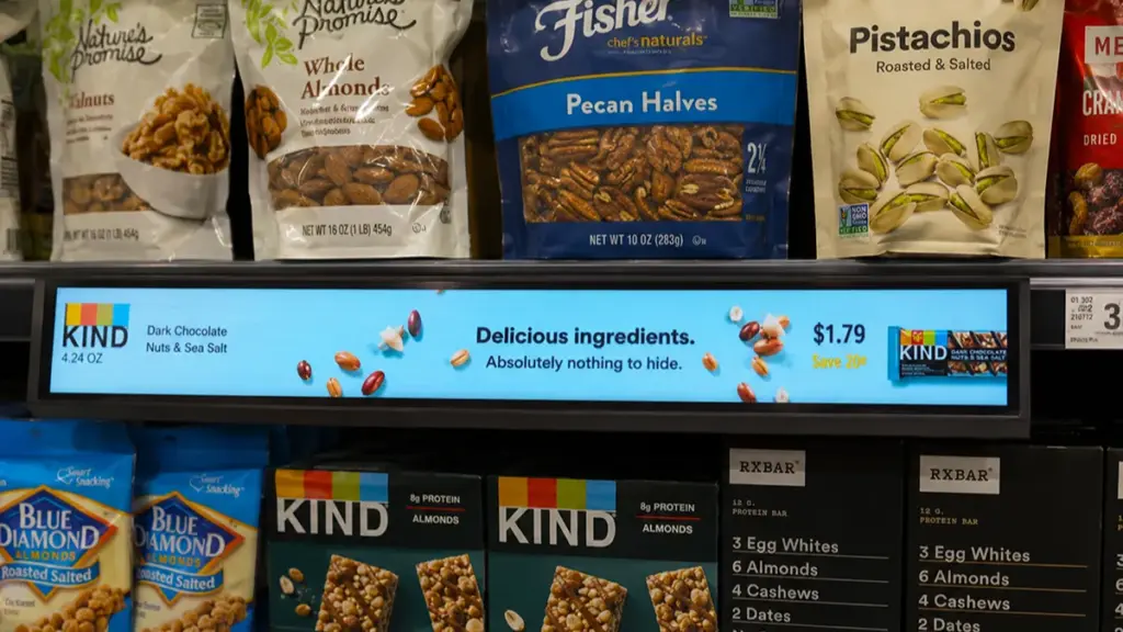 Digital shelf edge screen displaying promotions below grocery products