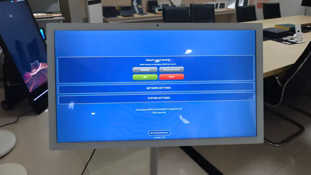Stand-alone touchscreen kiosk displaying system settings in an office